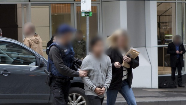 AFP officers with one of the people held in connection with the drug haul.  Read more: http://www.theage.com.au/victoria/eight-held-after-afp-find-275mworth-of-ice-under-shipping-container-floorboards-20160704-gpxzcs.html#ixzz4DW3300oQ  Follow us: @theage on Twitter | theageAustralia on Facebook