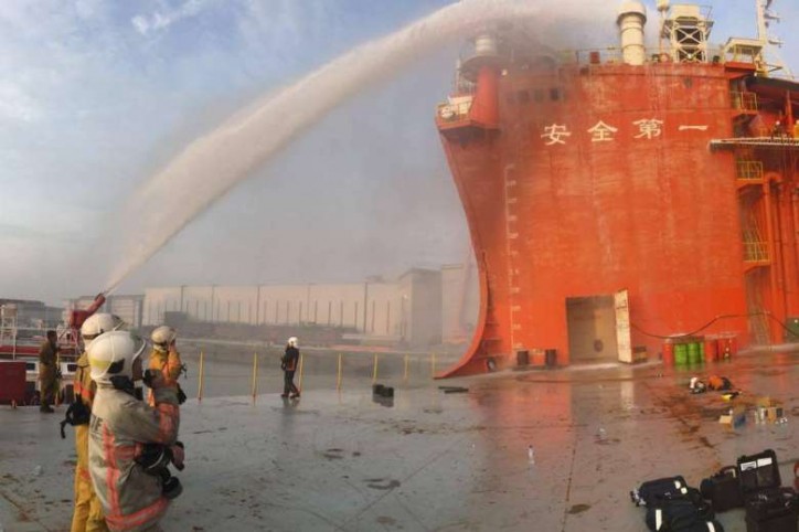 Seven hour operation to put out fire on cargo barge at Tuas shipyard, Singapore; Firefighter injured