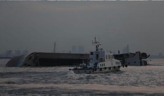 Freighter capsizes after collision with tanker carrying crude in Yangtze River