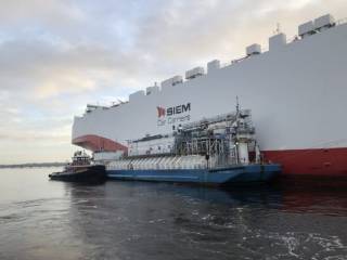 JAX LNG and TOTE Services conduct their first ship-to-ship LNG bunkering of a foreign-flagged vessel at JAXPORT